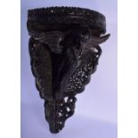 AN UNUSUAL 19TH CENTURY ANGLO INDIAN COLONIAL CARVED WOOD CORNER BRACKET formed as an eagle holding