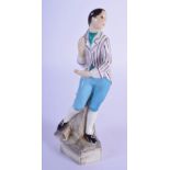 A ROYAL WORCESTER PORCELAIN FIGURE OF A BOY modelled upon a naturalistic stump. 14 cm high.