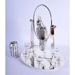 AN UNUSUAL SILVER PLATED SWINGING BIRD DECANTER modelled with six glasses. 40 cm x 225 cm.