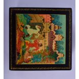 A RUSSIAN PAINTED BLACK LACQUER SQUARE FORM BOX painted with figures fighting before a palace. 14 cm