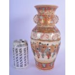 A 19TH CENTURY JAPANESE MEIJI PERIOD TWIN HANDLED SATSUMA VASE painted with figures within landscape