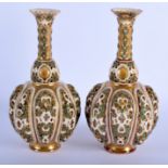 A PAIR OF ZSOLNAY PECS PORCELAIN RETICULATED VASES. 23.5 cm high.