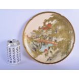 A LATE 19TH CENTURY JAPANESE MEIJI PERIOD SATSUMA DISH painted figures on a bridge within a landscap