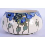 A RARE ART DECO ROYAL DOULTON CIRCULAR PORCELAIN BOWL painted with floral sprays. 17 cm diameter.