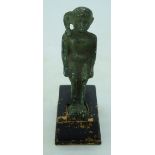 An Egyptian bronze figure of a Pharoah on a wooden stand. 9cm.