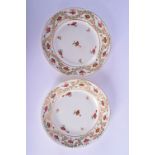 A PAIR OF EARLY 19TH CENTURY DERBY PORCELAIN CIRCULAR DISHES painted with flowers and gilt scrolls.