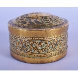 AN 18TH CENTURY INDIAN BRASS EMBOSSED BOX AND COVER decorated with a roaming animal amongst foliage.