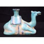 A glazed Egyptian ceramic camel. 12 x 19cm