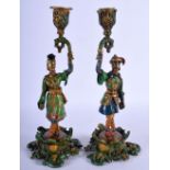 A RARE PAIR OF 19TH CENTURY COLD PAINTED EUROPEAN BRONZE CANDLESTICKS modelled upon foliate capped b
