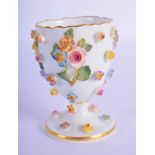 A 19TH CENTURY MEISSEN ENCRUSTED PORCELAIN EGG CUP overlaid with foliage. 7.5 cm high.