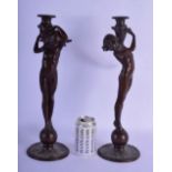 Edward Francis McCartan (1879-1947) American, Pair, Bronze water carriers. 42 cm high.