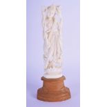A 19TH CENTURY ANGLO INDIAN CARVED IVORY FIGURE OF A BUDDHISTIC DEITY upon a wooden base. Ivory 15 c
