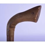 A 19TH CENTURY MIDDLE EASTERN CARVED RHINOCEROS HORN HANDLED WALKING CANE. 86 cm long.