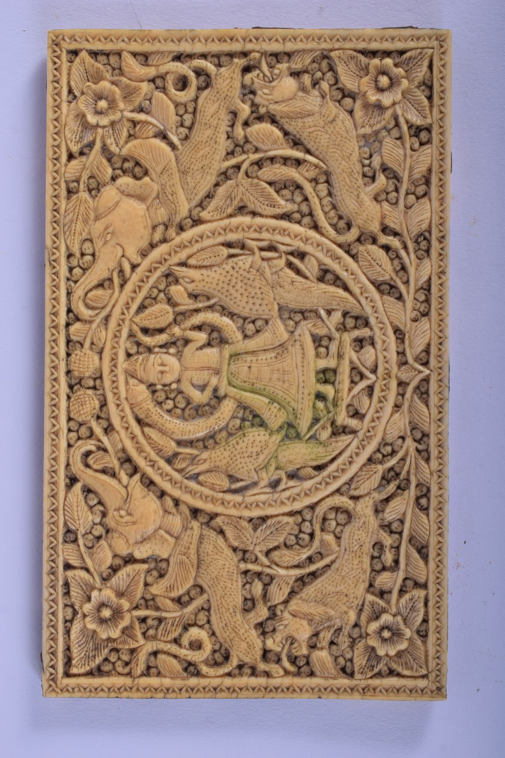 AN 18TH CENTURY INDIAN RECTANGULAR CARVED IVORY PANEL depicting Buddhistic figures and elephants amo