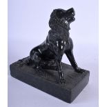 A 19TH CENTURY ITALIAN CARVED SERPENTINE FIGURE OF A DOG upon a rectangular base. 16 cm x 14 cm.