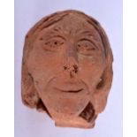 AN 18TH CENTURY CONTINENTAL CARVED TERRACOTTA WALL MOUNTED MASK HEAD. 26 cm x 17 cm.