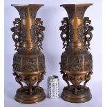 A LARGE PAIR OF 19TH CENTURY JAPANESE MEIJI PERIOD TWIN HANDLED BRONZE VASES decorated with animals