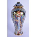 A FINE WEDGWOOD FAIRYLAND LUSTRE PORCELAIN VASE AND COVER by Daisy Makeig Jones. 23 cm high.