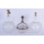 THREE UNUSUAL GLASS DECANTERS AND STOPPERS. Largest 24 cm high. (3)