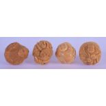 FOUR JAPANESE CARVED NUT NETSUKES. 3 cm wide. (4)