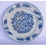 AN 18TH CENTURY DELFT BLUE AND WHITE TIN GLAZED DISH painted with flowers. 27 cm diameter.