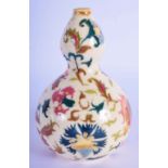 A HUNGARIAN ZSOLNAY PECS DOUBLE GOURD VASE painted with foliage and vines. 14 cm high.