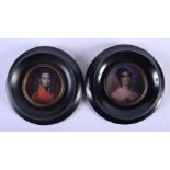 A PAIR OF CONTEMPORARY PORTRAIT MINIATURES. Image 6 cm diameter.