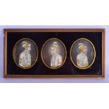 A SET OF THREE 19TH CENTURY INDIAN PAINTED IVORY PORTRAIT MINIATURES depicting royalty within a reve