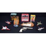 A collection of vintage wind up tin plate models together with a toy car and a replica cowboy gun (1