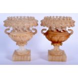 A PAIR OF 19TH CENTURY EUROPEAN GRAND TOUR CARVED ALABASTER URNS. 14 cm x 11 cm.