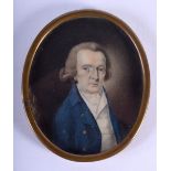AN 18TH CENTURY ENGLISH PAINTED IVORY PORTRAIT MINIATURE depicting a male wearing a blue coat. 7.5 c