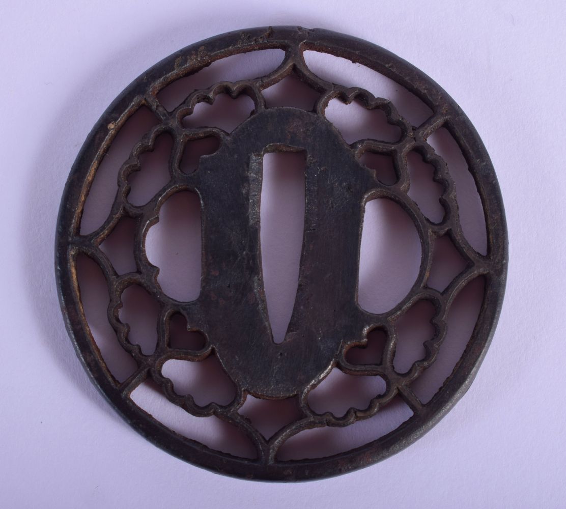 AN 18TH/19TH CENTURY JAPANESE IRON TSUBA of openwork form. 5.5 cm wide.