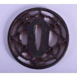 AN 18TH/19TH CENTURY JAPANESE IRON TSUBA of openwork form. 5.5 cm wide.