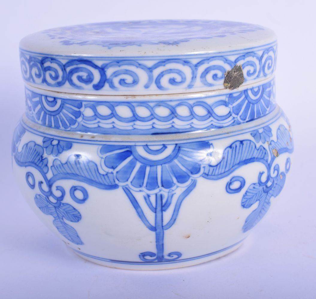 A 19TH CENTURY JAPANESE BLUE AND WHITE PORCELAIN JAR AND COVER painted with flowers and a dragon. 11