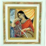 A framed Persian miniature on Ivory of a young woman 10 x 8cm .