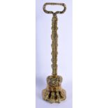 A GEORGE III BRASS LION PAW DOOR STOP. 37 cm high.