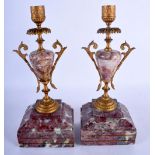 A PAIR OF 19TH CENTURY FRENCH GILT METAL MOUNTED MARBLE CANDLESTICKS. 27 cm high.