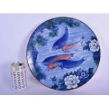 A JAPANESE TAISHO PERIOD PORCELAIN BLUE AND WHITE DISH decorated with swimming carp. 30 cm diameter.