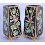 A PAIR OF 19TH CENTURY AESTHETIC MOVEMENT ENAMELLED GLASS VASES painted with birds in flight. 18 cm
