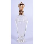AN 18CT GOLD MOUNTED CRYSTAL GLASS SCENT BOTTLE. 10.5 cm high.