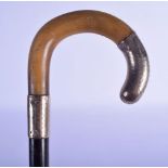 A 19TH CENTURY CONTINENTAL CARVED RHINOCEROS HORN HANDLED WALKING CANE. 85 cm long.