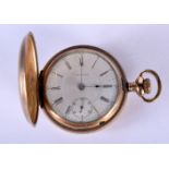 A WALTHAM FULL HUNTER YELLOW METAL POCKET WATCH. 5 cm diameter.