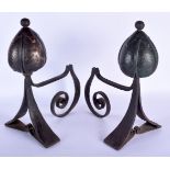 A STYLISH PAIR OF ART NOUVEAU COPPER AND WROUGHT IRON ANDIRONS of highly organic form. 40 cm x 30 cm