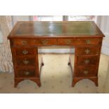 AN EARLY 20TH CENTURY SWEDISH MAHOGANY KNEEHOLE DESK together with another kneehole desk. Largest 12