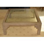 A MODERNIST DESIGNER IMITATION MARBLE COFFEE TABLE with glass top and brass surround. 110 cm square.