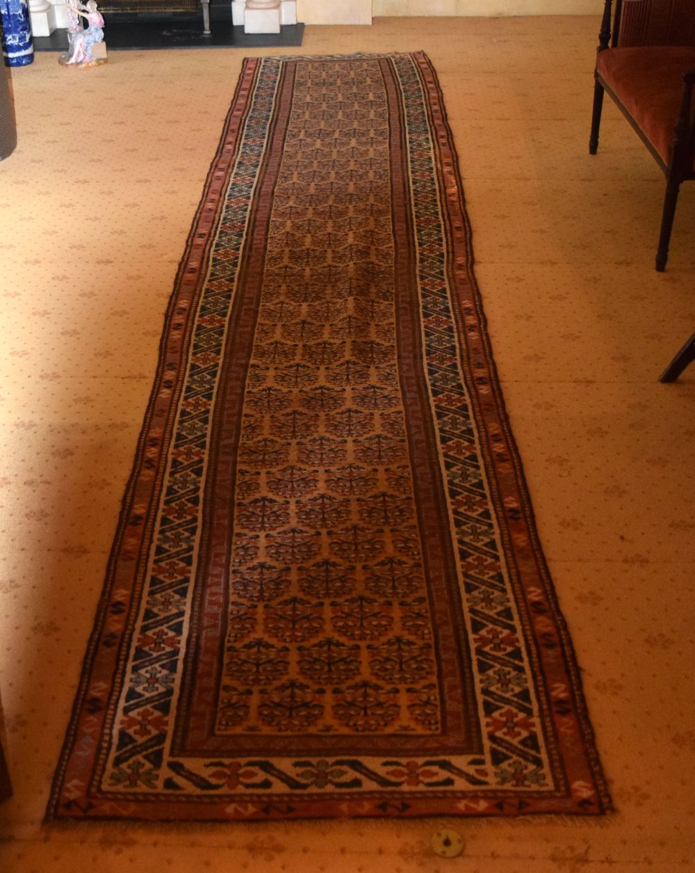 A LONG ANTIQUE PERSIAN RUNNER. 456 cm x 90 cm.