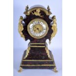 AN UNUSUAL MID 19TH CENTURY FRENCH IMITATION TORTOISESHELL MANTEL CLOCK formed with figural supports