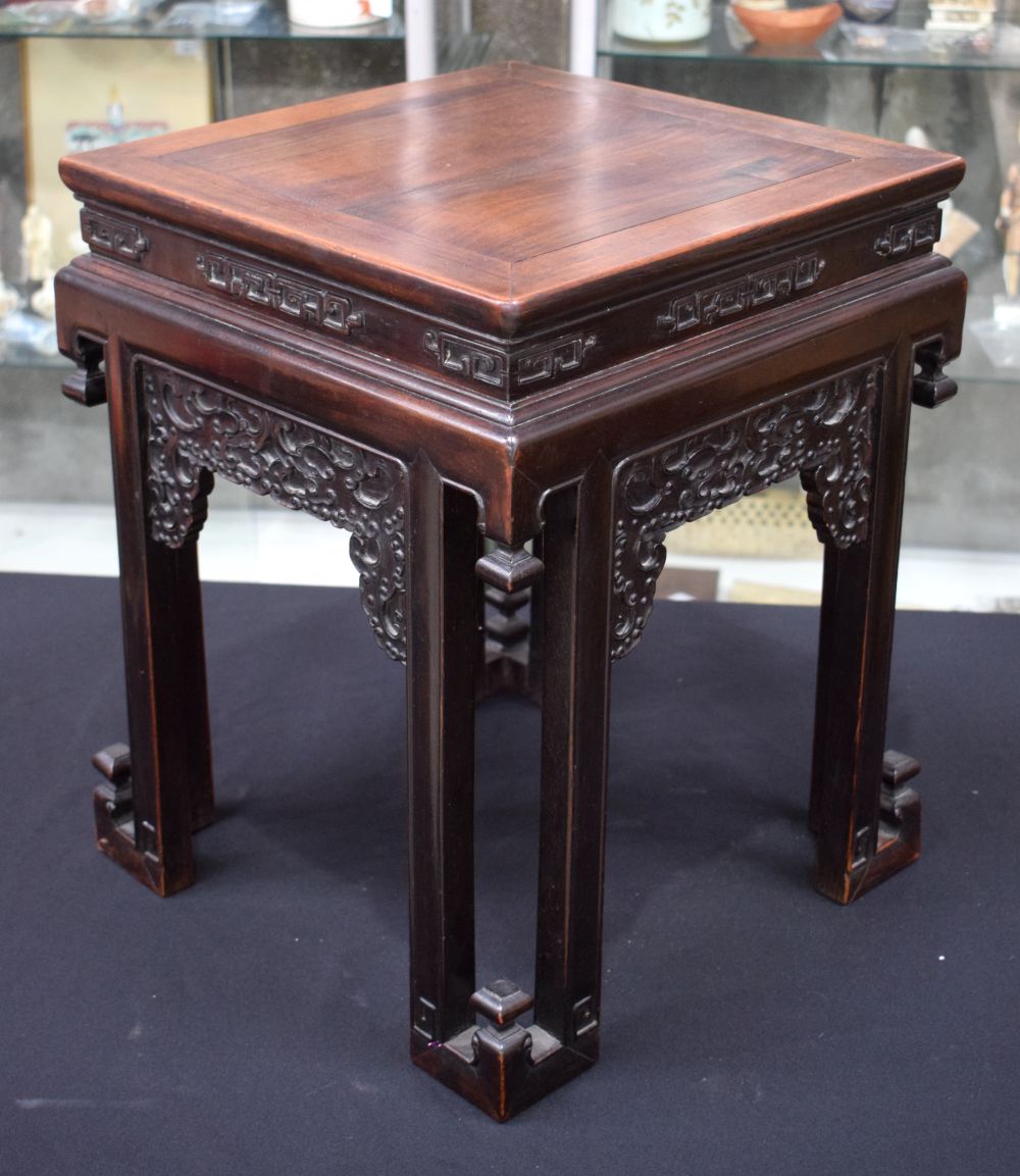A FINE 19TH CENTURY CHINESE CARVED HONGMU SQUARE FORM STAND Qing, of unusual form with stylised beas