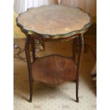 A LATE 19TH CENTURY CONTINENTAL BRONZE OVERLAID SIDE TABLE with shaped glass top and scrolling legs.
