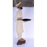 A VINTAGE PAINTED WOOD BUSINESS CARD HOLDER in the form of a Middle Eastern male. 97 cm high.